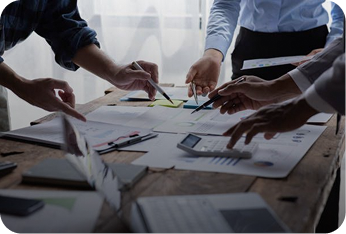 Professionals collaborating around a planning table